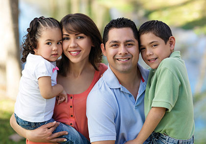 Photo of a happy family. Link to Life Stage Gift Planner Under Age 45 Situations.
