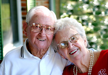 Photo of a man and woman smiling for a picture. Link to Life Stage Gift Planner Over Age 65 Situations.