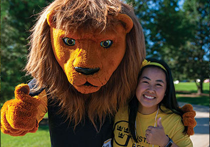 Mascot giving thumbs up with student. Links to Donor-Advised Funds
