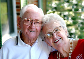 Photo of a man and woman smiling for a picture. Link to Life Stage Gift Planner Over Age 65 Situations.